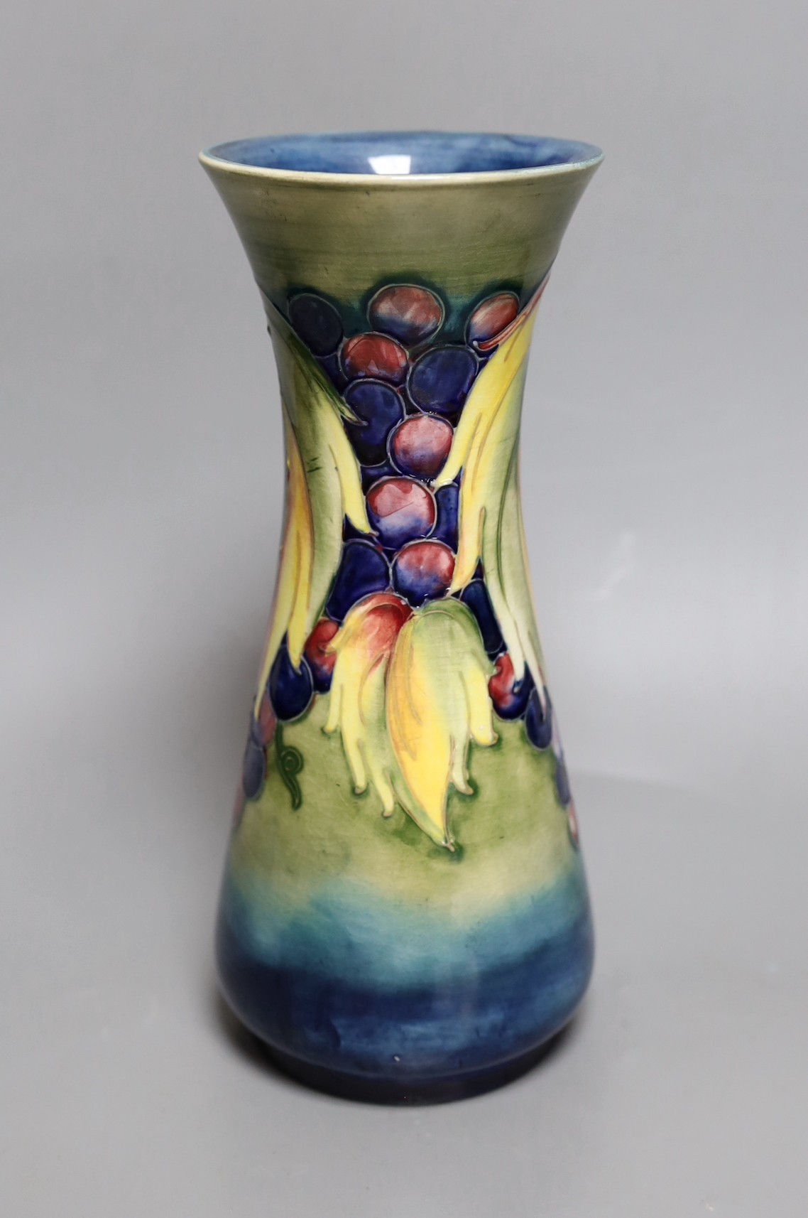 A Moorcroft leaf and berry vase, 26cm